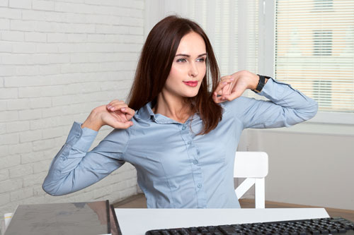 Lady stretching at work